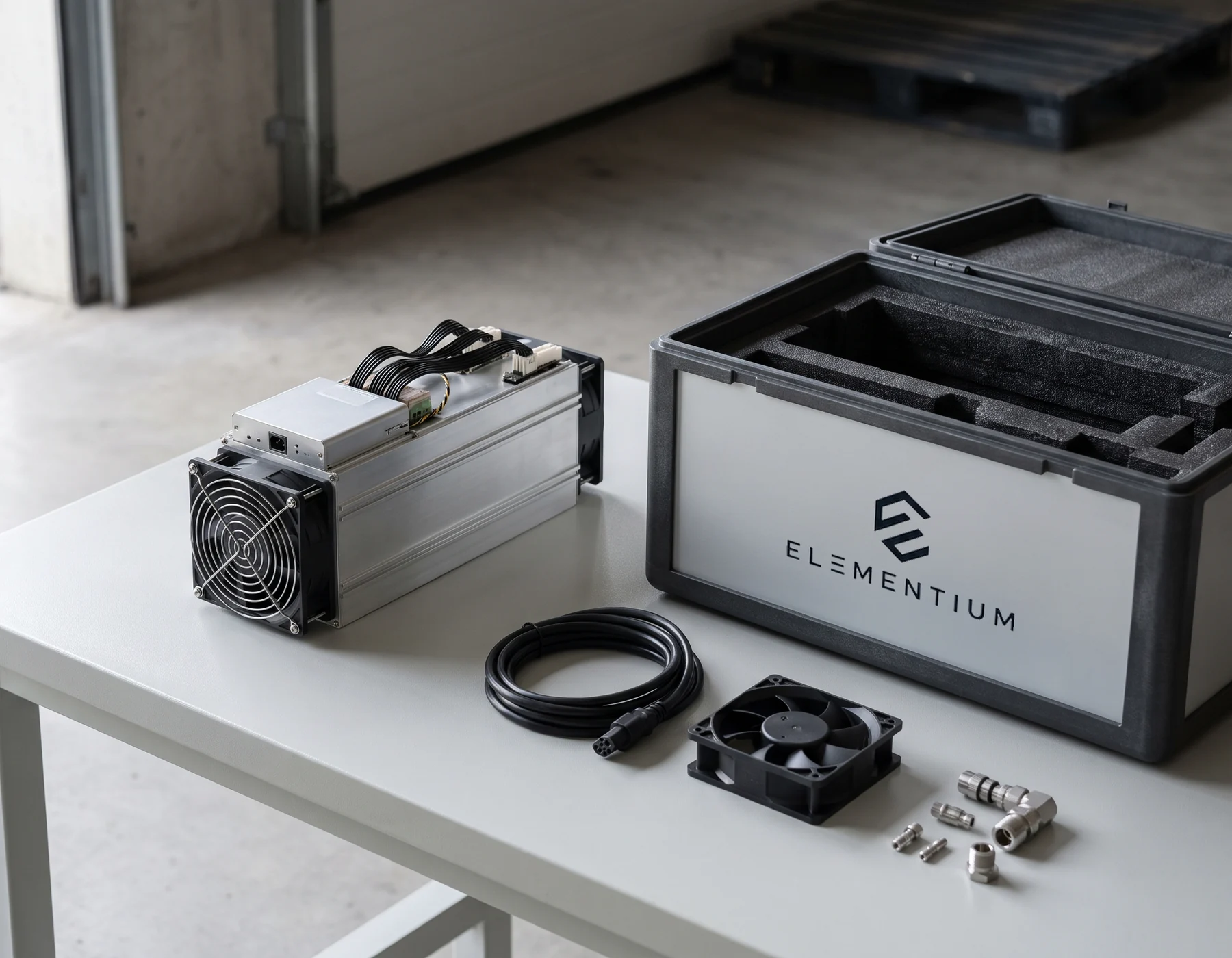 Illustrative mining hardware prepared for shipment beside an Elementium-branded transit case, cable and cooling components